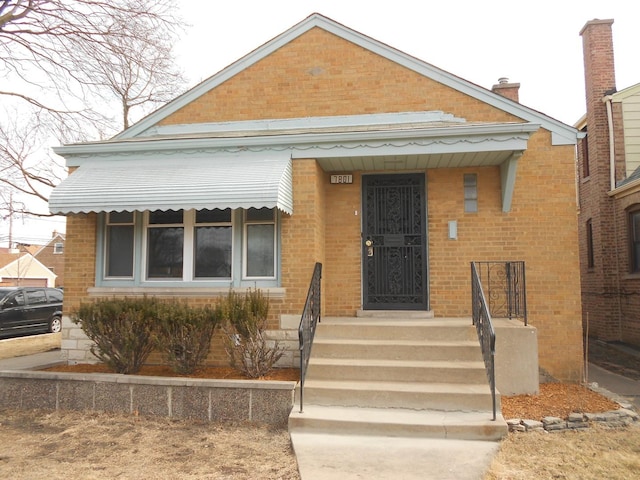 view of front of house with brick siding