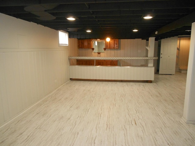 below grade area featuring light wood-style floors