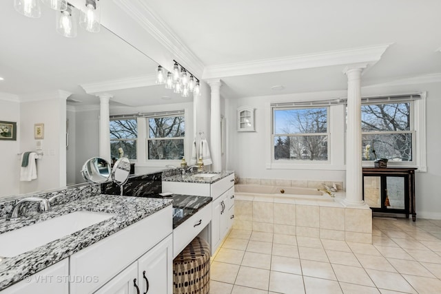 full bath featuring ornamental molding, decorative columns, a bath, and tile patterned floors