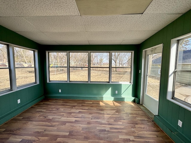 unfurnished sunroom featuring a paneled ceiling