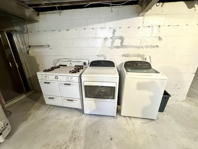 clothes washing area featuring laundry area and separate washer and dryer