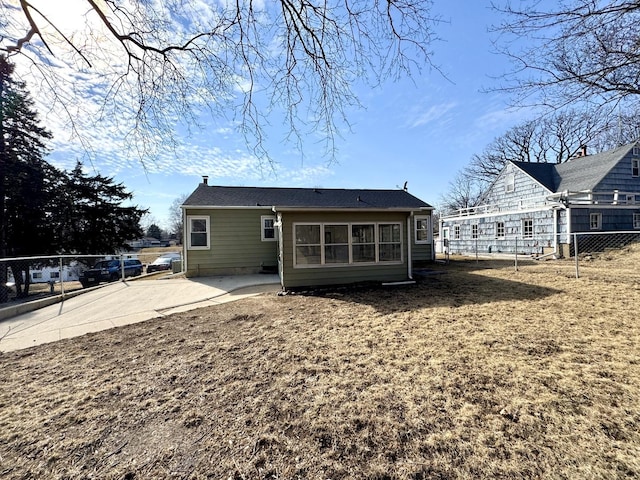 back of property with fence