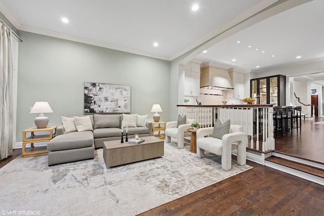 living area featuring dark wood-style floors, recessed lighting, and crown molding