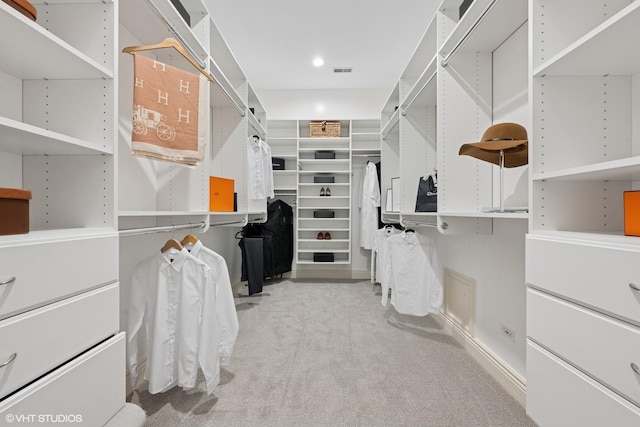 walk in closet featuring carpet and visible vents