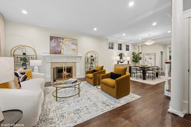 living room with crown molding, wood finished floors, and recessed lighting