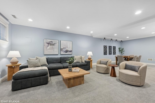 living area featuring baseboards, carpet, visible vents, and recessed lighting