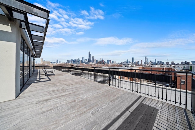 wooden terrace with a city view