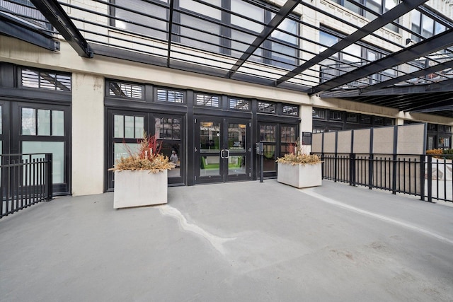 entrance to property featuring french doors