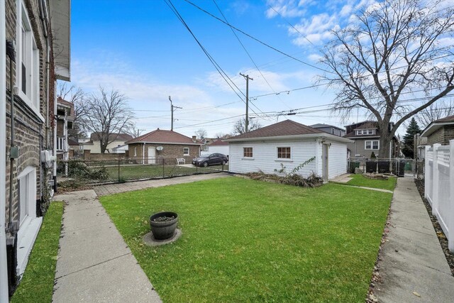 view of yard featuring a fenced backyard and an outdoor structure