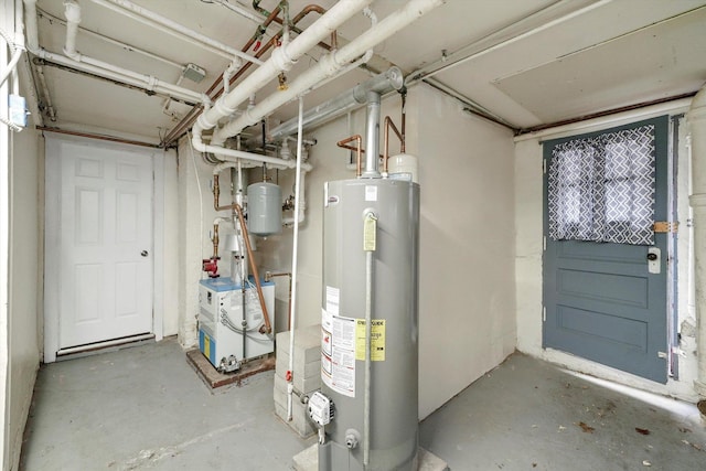 utility room featuring water heater and a heating unit