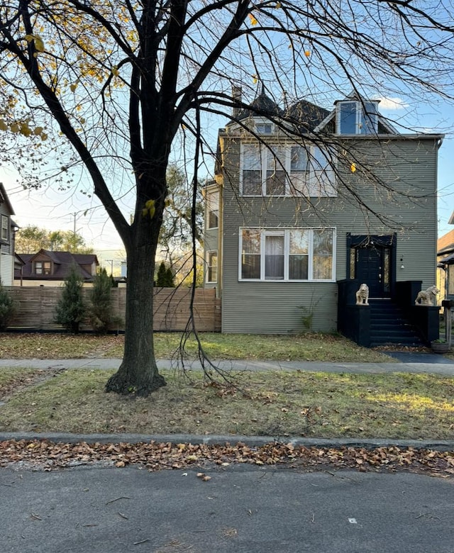 view of front of house with fence