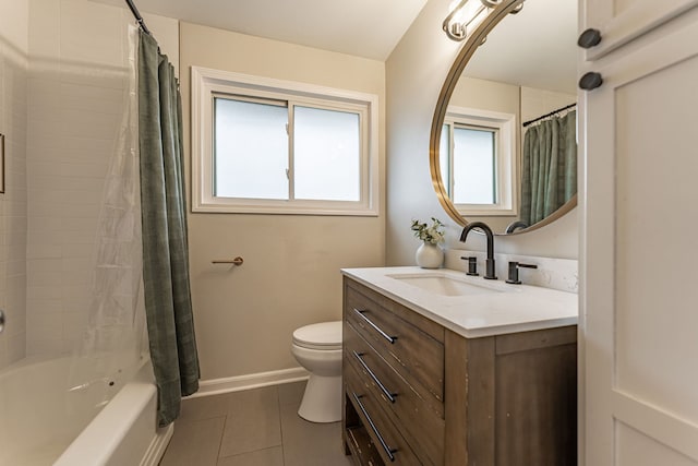 bathroom featuring shower / tub combo with curtain, toilet, vanity, tile patterned flooring, and baseboards