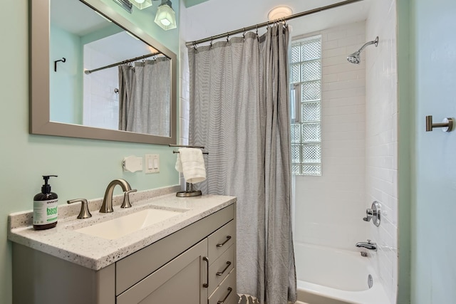 full bathroom with vanity and shower / tub combo