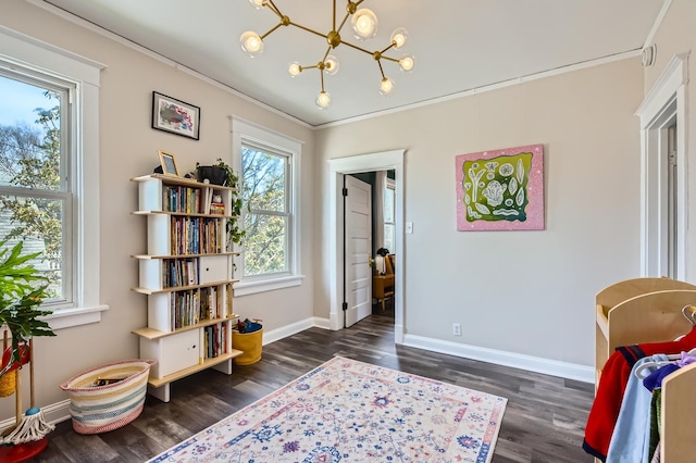 interior space featuring dark wood-type flooring, a chandelier, and a wealth of natural light