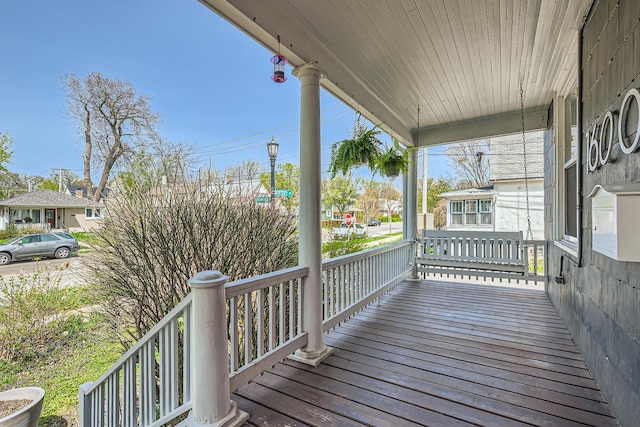 wooden terrace with a porch