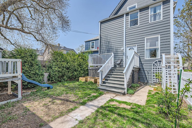 view of yard featuring fence and a deck
