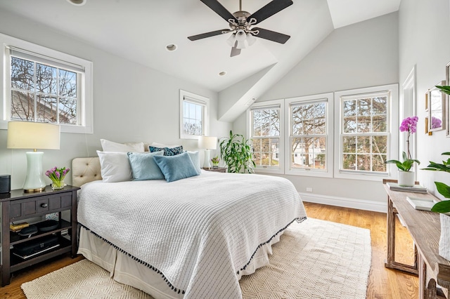 bedroom with lofted ceiling, recessed lighting, ceiling fan, wood finished floors, and baseboards