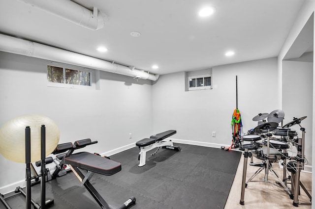 exercise area with recessed lighting and baseboards