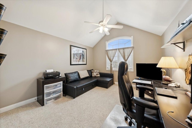 carpeted office space featuring lofted ceiling, ceiling fan, and baseboards