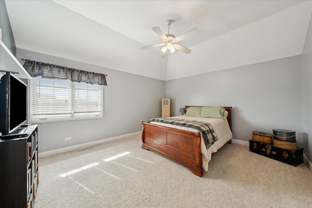 carpeted bedroom featuring vaulted ceiling, a ceiling fan, and baseboards