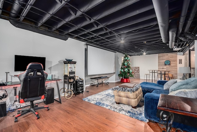 home theater room with wood finished floors