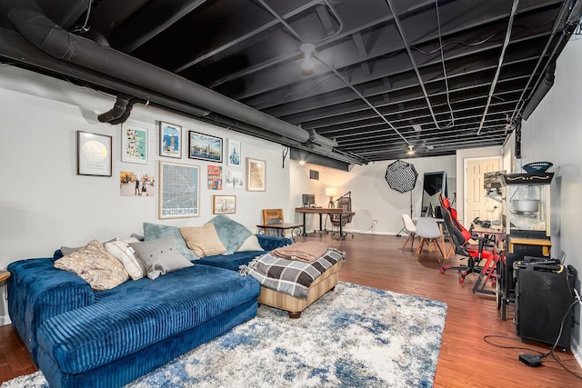 living area featuring wood finished floors and baseboards