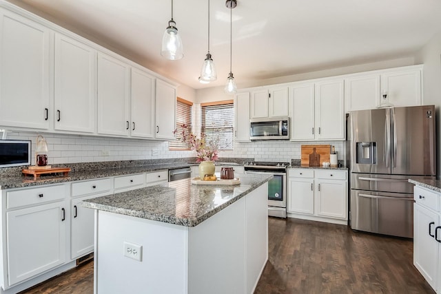 kitchen featuring appliances with stainless steel finishes and white cabinets