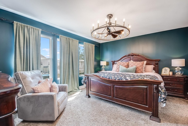 carpeted bedroom featuring a chandelier