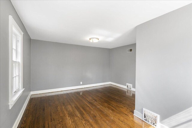 1055 S Myrtle Ave, Kankakee, IL 60901 - spare room with dark wood-style flooring and baseboards