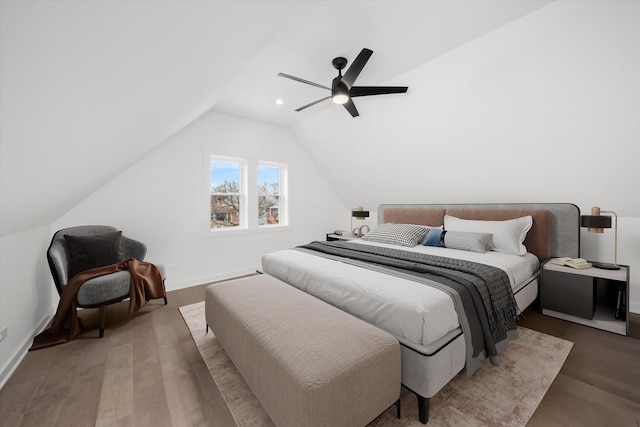 bedroom featuring lofted ceiling, recessed lighting, ceiling fan, wood finished floors, and baseboards