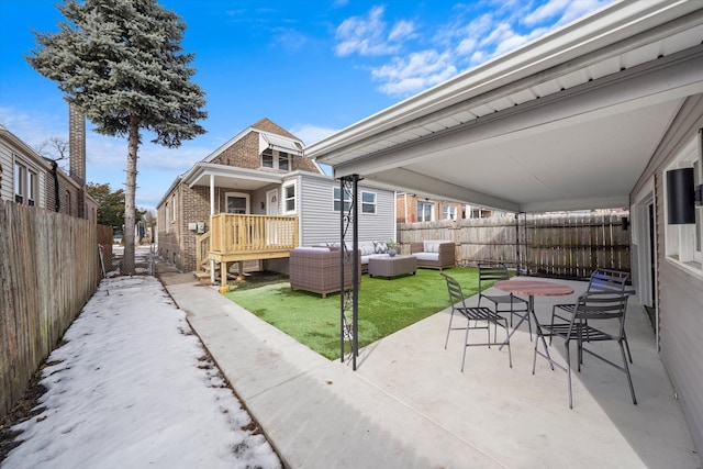 view of patio with outdoor lounge area and a fenced backyard