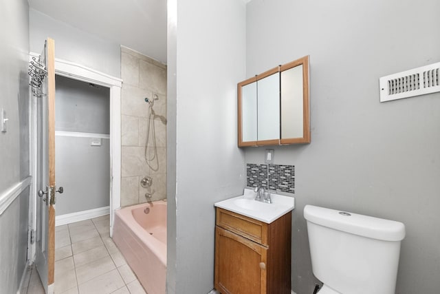 full bathroom with backsplash, toilet, washtub / shower combination, vanity, and tile patterned floors