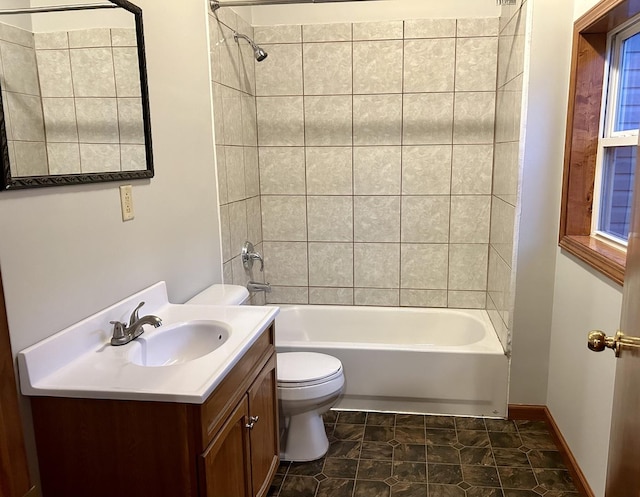 full bath with bathtub / shower combination, vanity, and toilet