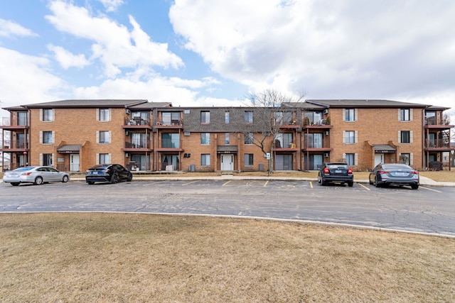 view of property with uncovered parking