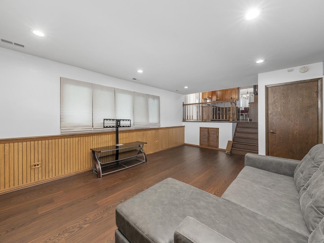 living room with recessed lighting, visible vents, stairway, wainscoting, and wood finished floors