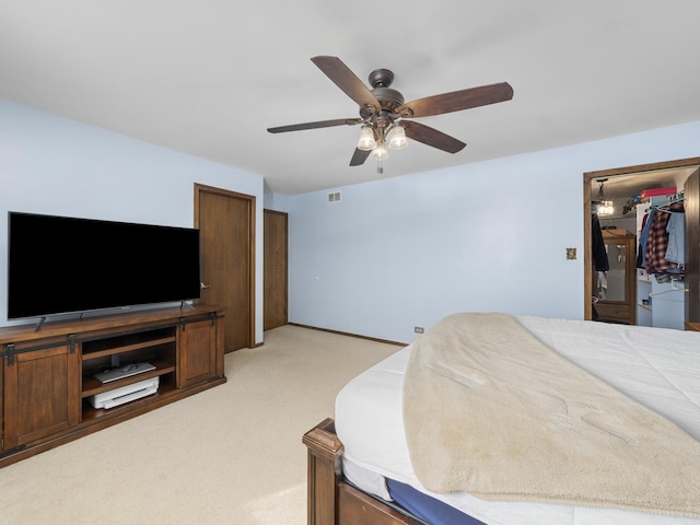 bedroom featuring a ceiling fan, light colored carpet, and visible vents