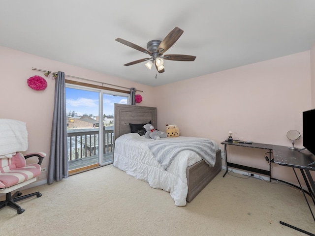 carpeted bedroom with access to outside and ceiling fan