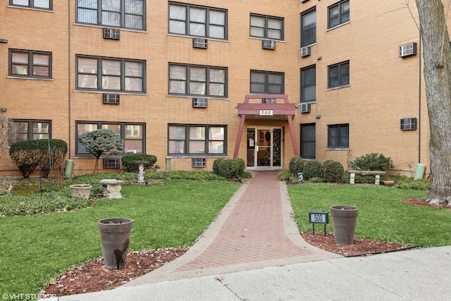 view of property featuring an AC wall unit