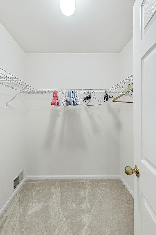 spacious closet featuring carpet floors and visible vents