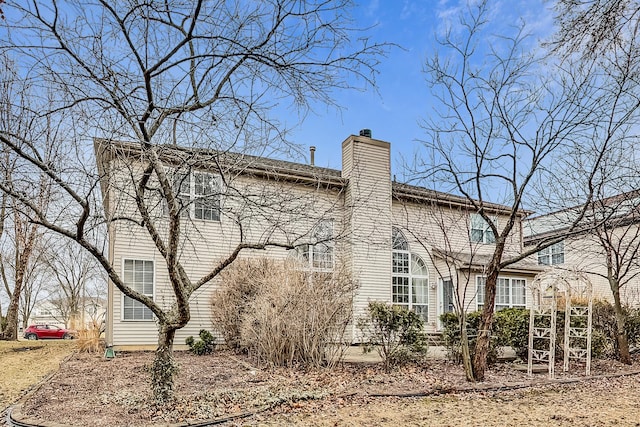 view of home's exterior with a chimney