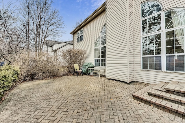 view of side of home featuring a patio