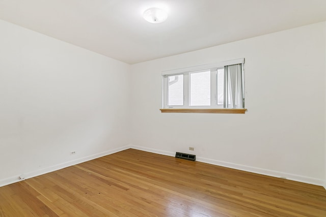 2547 2nd Ave, North Riverside, IL 60546 - spare room with baseboards and light wood-style flooring