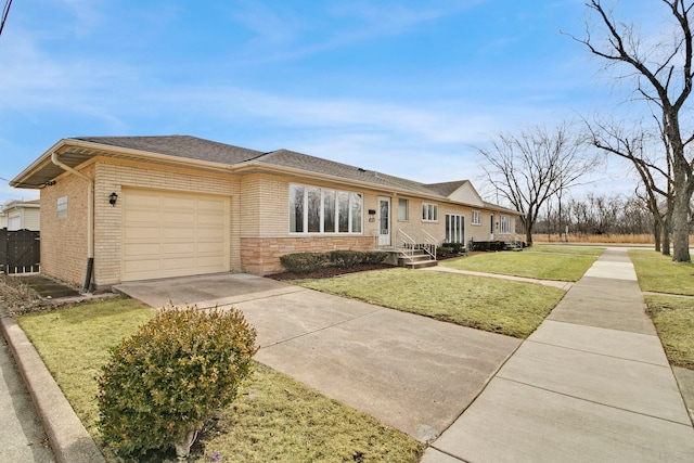 2547 2nd Ave, North Riverside, IL 60546 - view of front of property with driveway, a garage, a front lawn, and brick siding