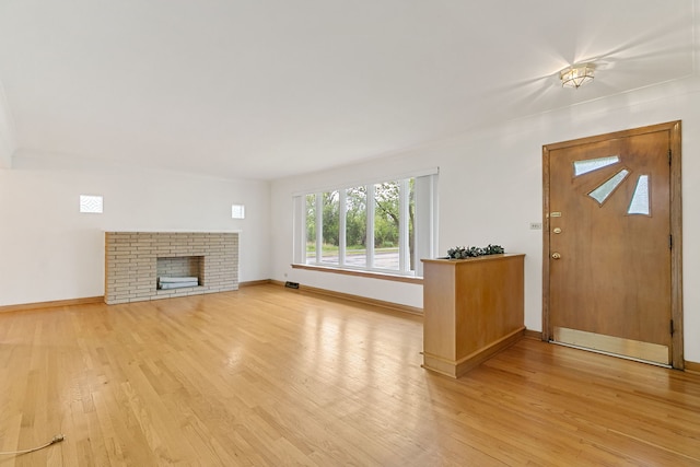 2547 2nd Ave, North Riverside, IL 60546 - foyer featuring light wood-style floors, baseboards, and a brick fireplace