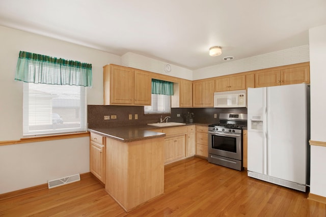 2547 2nd Ave, North Riverside, IL 60546 - kitchen featuring white appliances, light brown cabinetry, a sink, and light wood finished floors