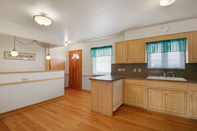 2547 2nd Ave, North Riverside, IL 60546 - kitchen featuring white dishwasher, light wood-style flooring, a sink, a peninsula, and tasteful backsplash