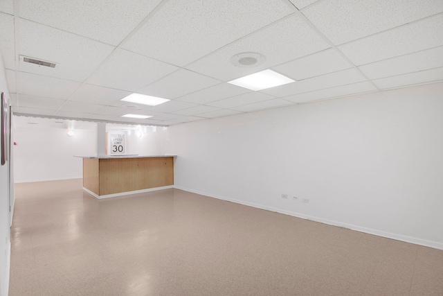 2547 2nd Ave, North Riverside, IL 60546 - finished below grade area with baseboards, a paneled ceiling, and bar area