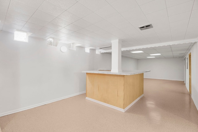2547 2nd Ave, North Riverside, IL 60546 - basement featuring a bar, baseboards, and a paneled ceiling