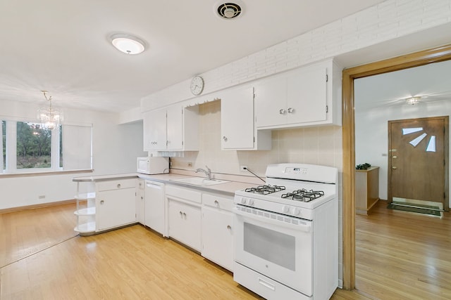 2547 2nd Ave, North Riverside, IL 60546 - kitchen with white appliances, a sink, light countertops, backsplash, and light wood-style floors