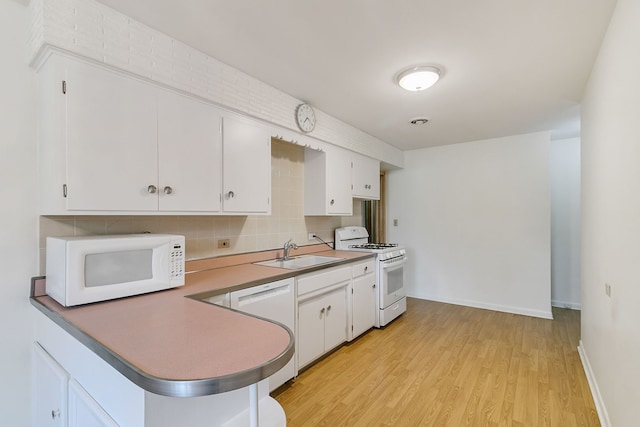 2547 2nd Ave, North Riverside, IL 60546 - kitchen with white appliances, a sink, light wood-type flooring, white cabinetry, and tasteful backsplash